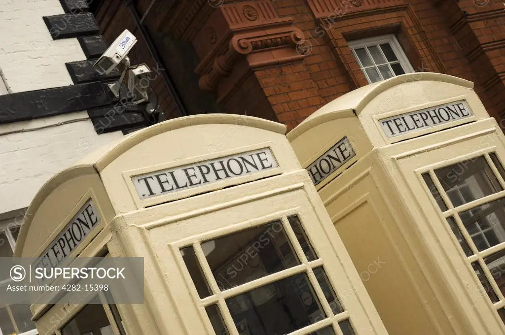 England, East Riding of Yorkshire, Beverley. Two cream public telephone boxes in the Saturday Market at Beverley.