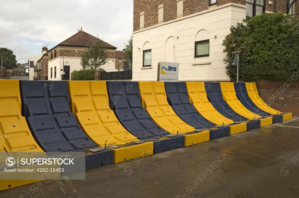 England, North Yorkshire, York. A temporary removable flood barrier to stop the River Ouse flooding at Clementhorpe.