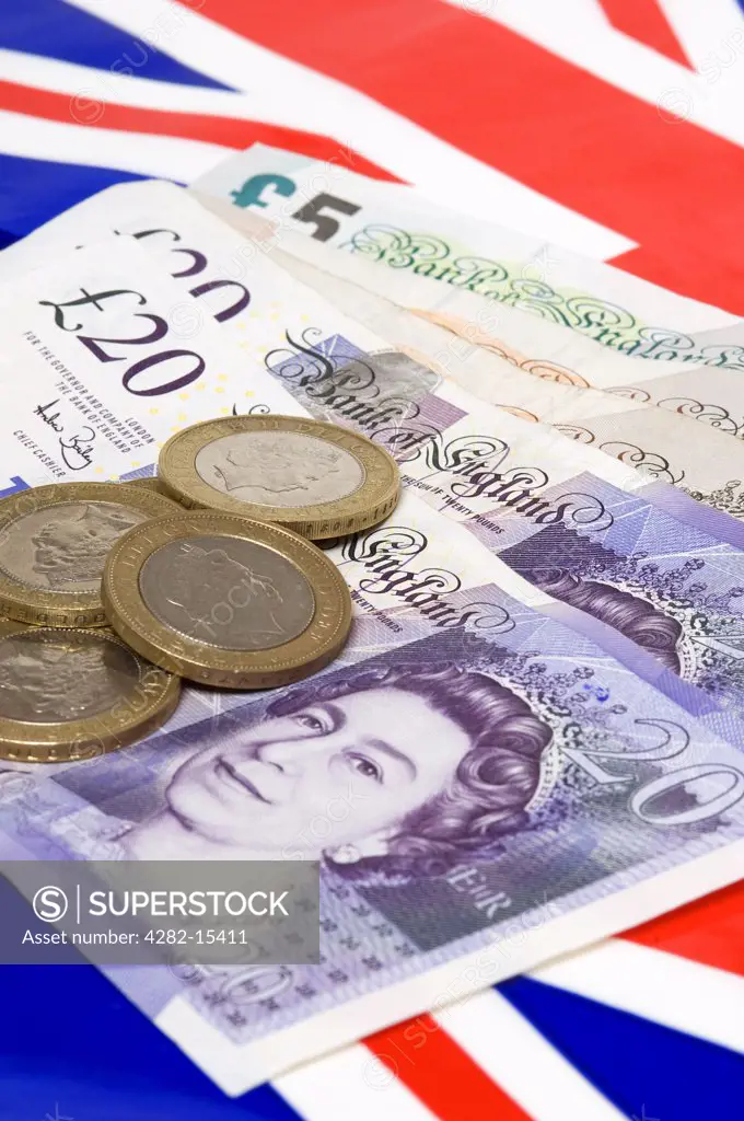 England. English currency with Union flag in the background.