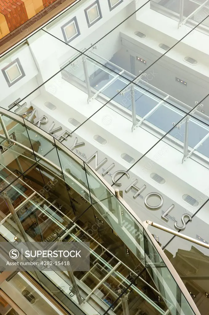 England, West Yorkshire, Leeds. A glass canopy over the entrance to the Harvey Nichols store in Leeds.