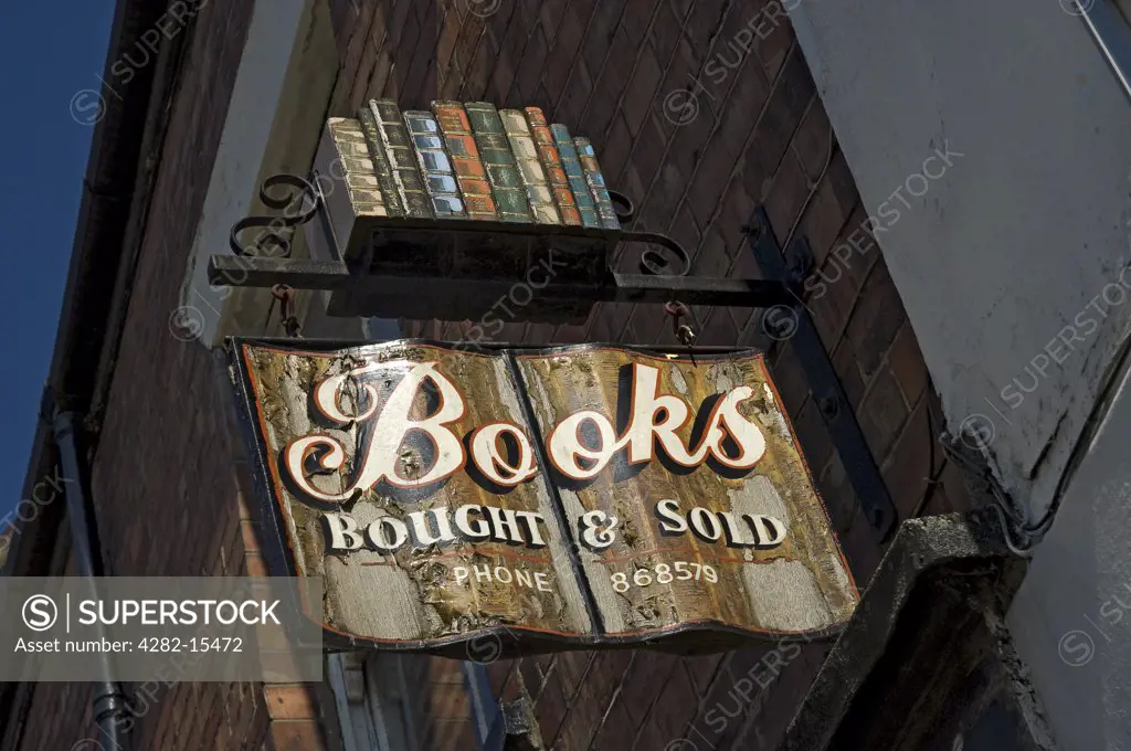 England, East Riding of Yorkshire, Beverley. An old wooden bookshop sign mounted on a wall outside.