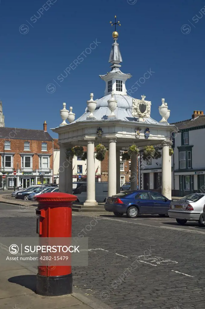England, East Riding of Yorkshire, Beverley. A red post box opposite Market Cross in Saturday Market, Beverley.