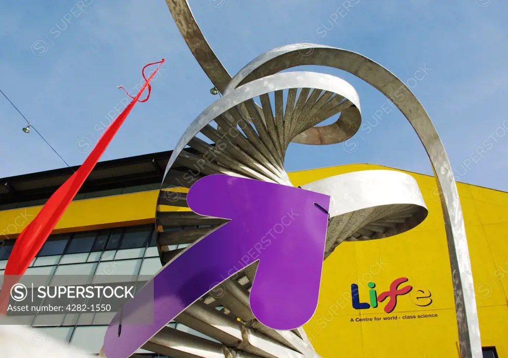 England, Tyne and Wear, Newcastle Upon Tyne. A purple arrow and red ribbon on a steel sculpture at The Centre For Life.
