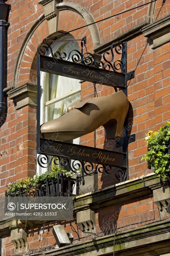 England, North Yorkshire, York. The Golden Slipper (Free House) sign hanging outside the pub in Goodramgate.