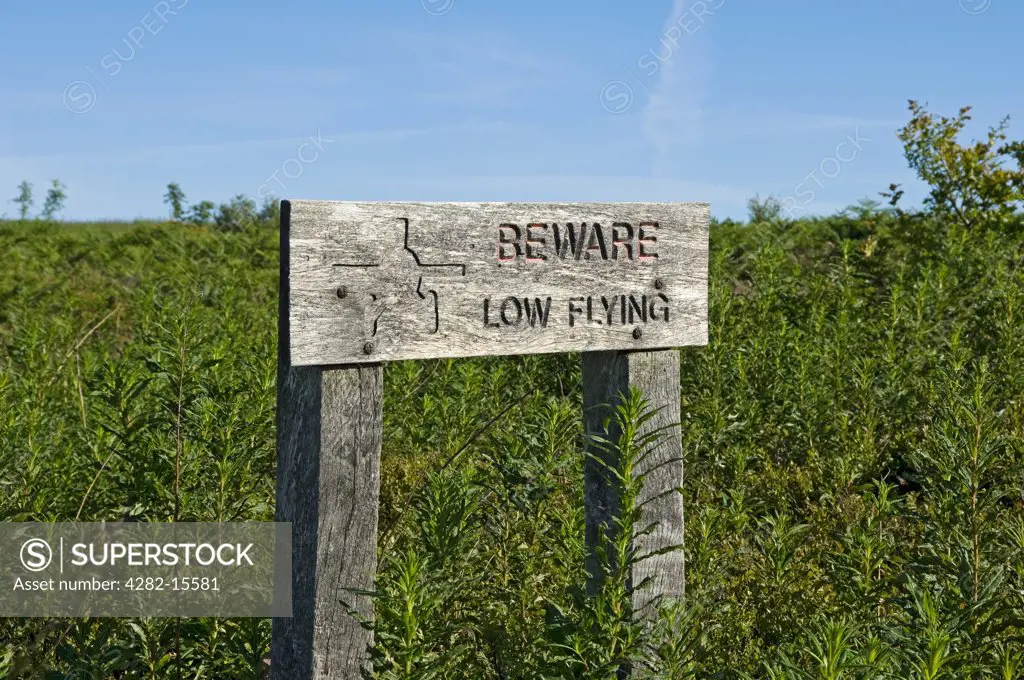 England, North Yorkshire. Wooden sign advising to beware low flying aircraft.