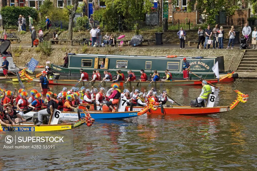 England, North Yorkshire, York. Teams preparing to compete in the York Rotary Dragon Boat Challenge on the River Ouse.