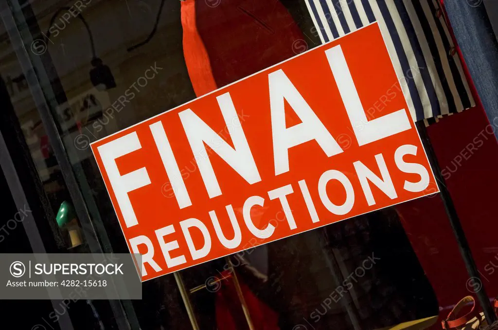 England, North Yorkshire, York. Final reductions sign in a shop window.