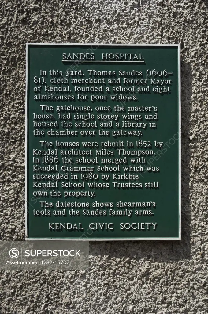 England, Cumbria, Kendal. A plaque on a wall to commemorate the former Sandes Hospital in Highgate, founded by Thomas Sandes in 1659.