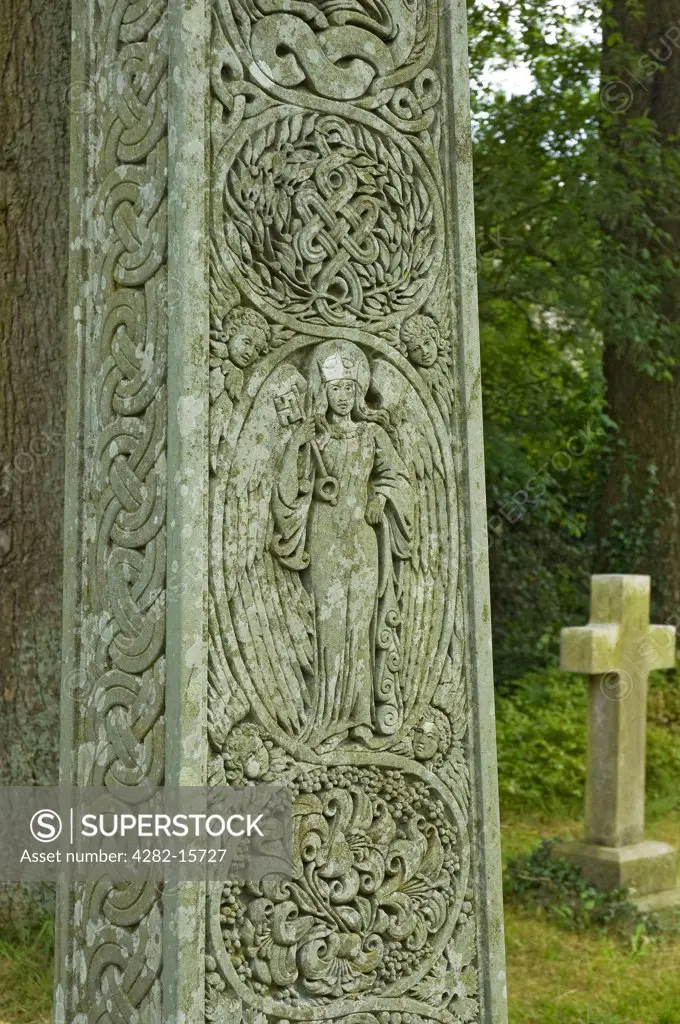 England, Cumbria, Coniston. Close up detail of Celtic cross which marks John Ruskin's grave in St Andrews churchyard in the village of Coniston.