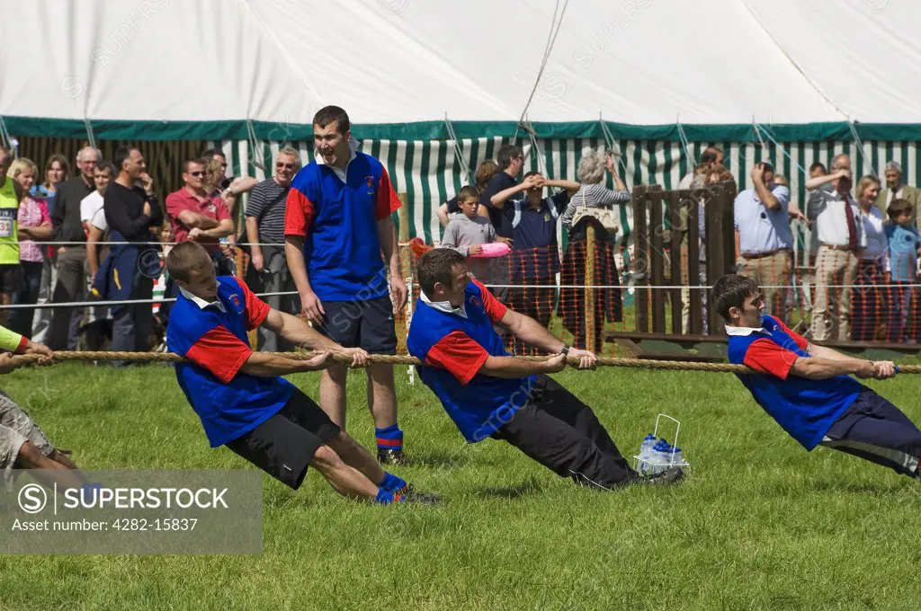 England, North Yorkshire, Gargrave. A team competing in the tug of war competition at Gargrave Show, an annual country show near Skipton.