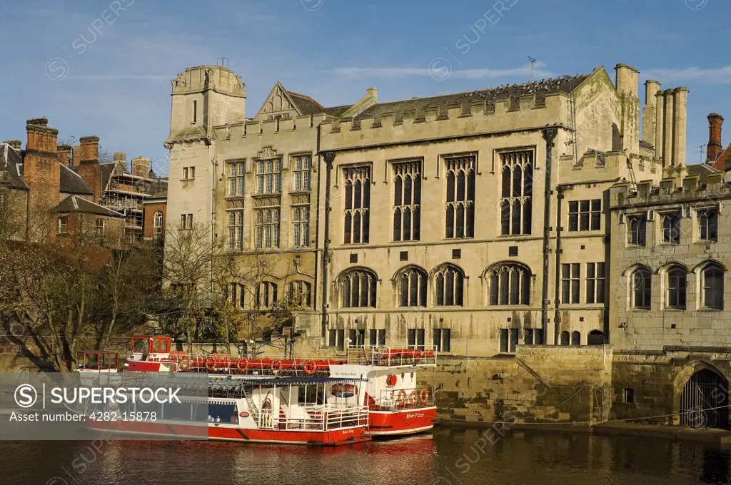 England, North Yorkshire, York. Pleasure boats moored beside the Guildhall on the River Ouse.