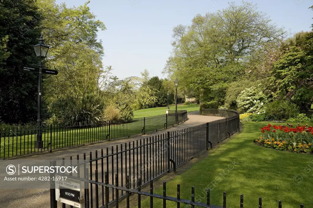 England, North Yorkshire, York. Black railings at the entrance to the Museum Gardens in York.