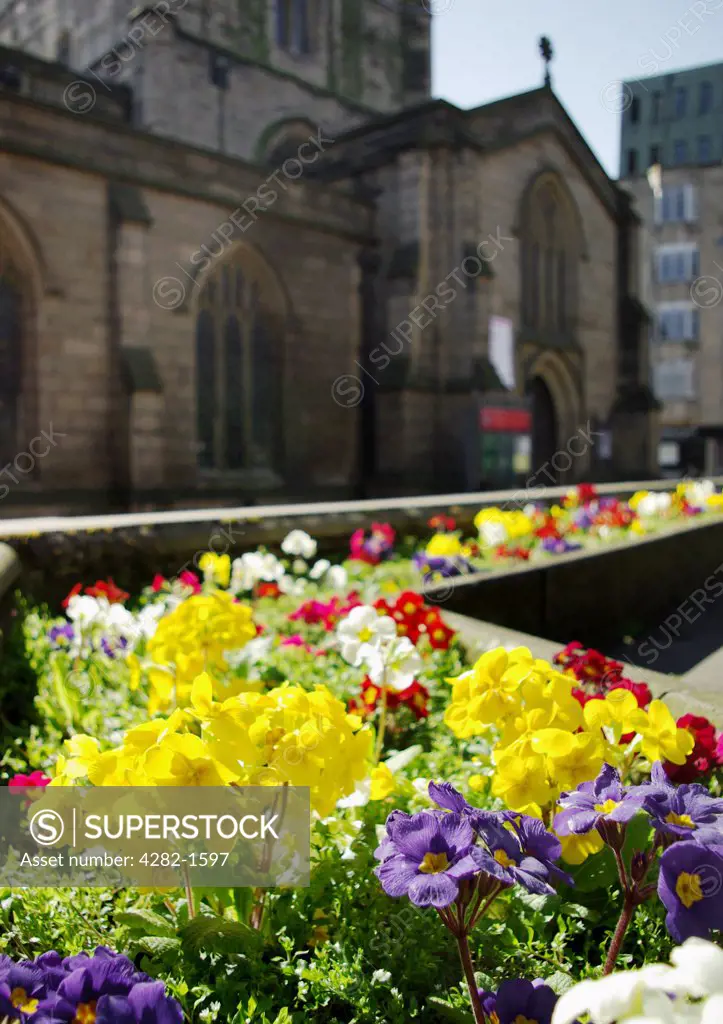 England, Tyne & Wear, Newcastle Upon Tyne. Bright coloured flowerbeds in front of St. Nicholas' Cathedral.