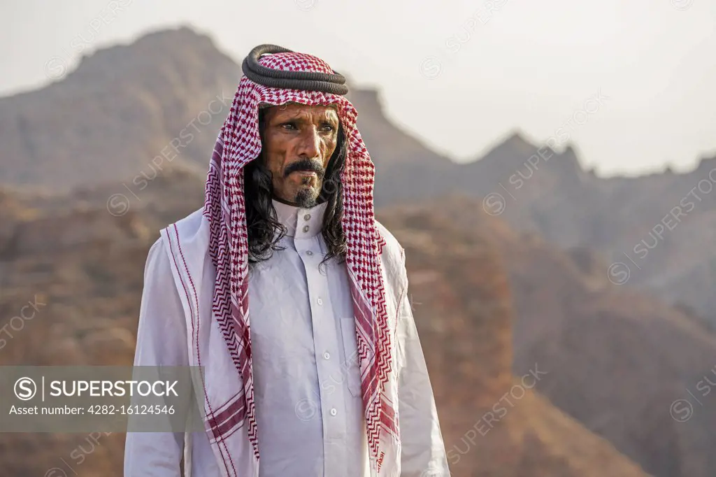 A Bedouin man looks out across his mountainous desert home in Jordan.