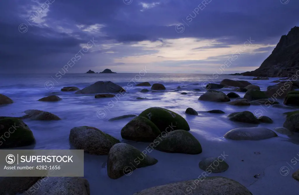 England, Cornwall, Porth Nanven. Large ovoid rocks on Porth Nanven beach at dusk.