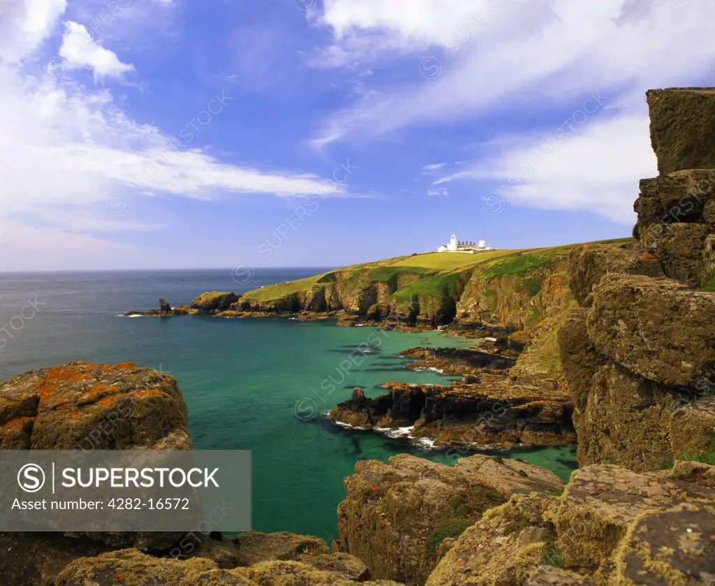 England, Cornwall, Housel Bay. Lizard Lighthouse viewed from Housel Bay. Lizard Point Is the most southerly point on mainland Britain, It also marks the meeting of the Atlantic ocean and the English Channel.