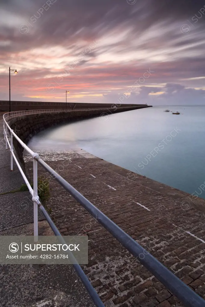 Channel Islands, Jersey, St Catherine. Dawn at St Catherine's breakwater, constructed in the mid 19th century originally as a refuge harbour for the Royal Navy.
