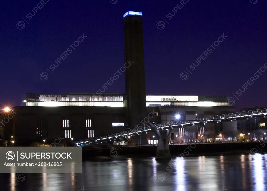 England, London, South Bank. Tate Modern at night. Tate Modern was created in the year 2000 to display the national collection of international modern art (defined as art since 1900).