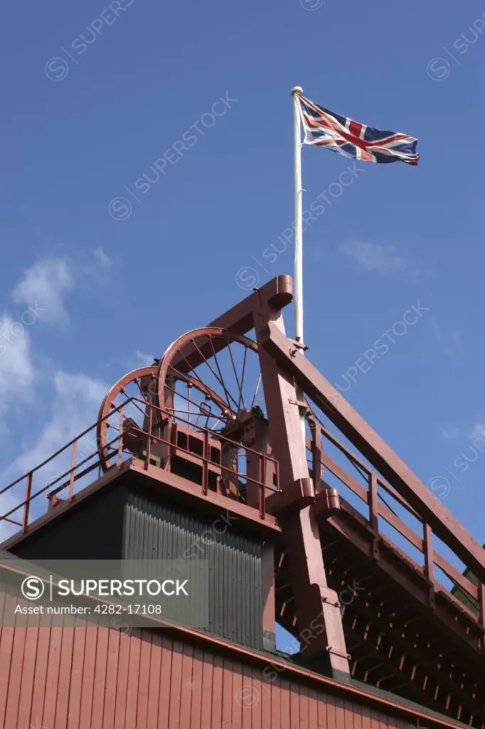 England, County Durham, Beamish. Union flag flying above a colliery at Beamish, The Living Museum of the North. Beamish is an open air museum displaying life in North East England at the beginning of the 20th century.