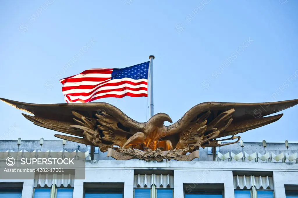 England, London, Mayfair. The Bald Eagle and stars and stripes flag on top of the US embassy.