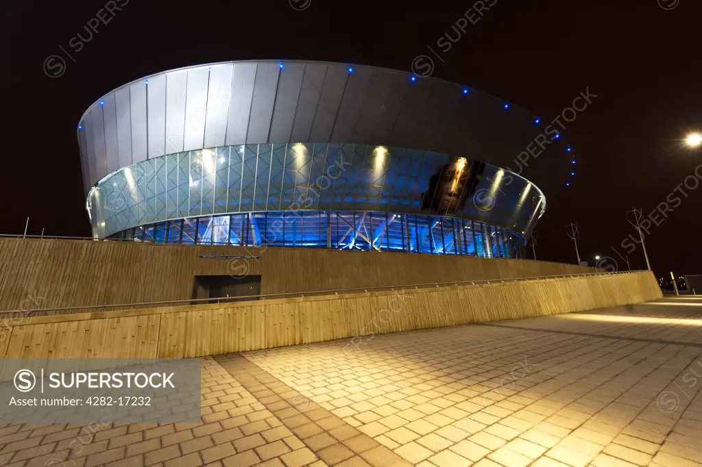 England, Merseyside, Liverpool. The Echo Arena on the Liverpool waterfront at night.