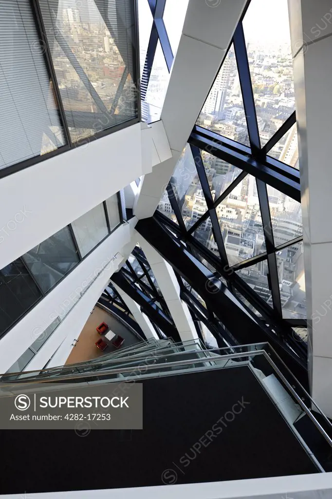 England, London, City of London. Internal view looking down the atrium at 30 St Mary Axe, known as the Gherkin.