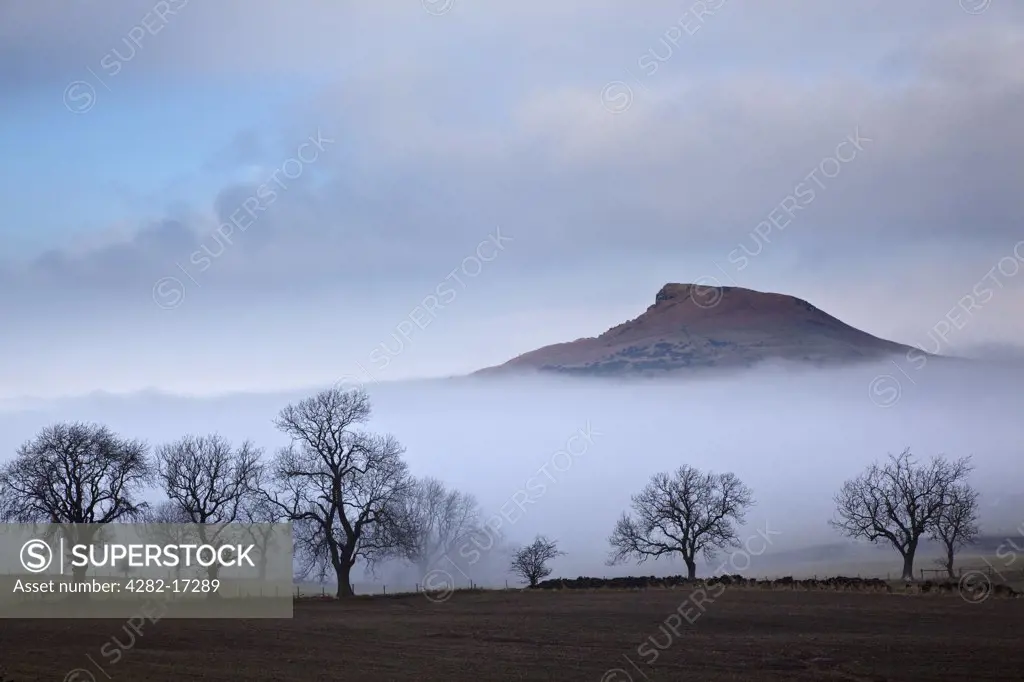 England, North Yorkshire, Roseberry Topping. February mist revealing the distinctive summit of Roseberry Topping often compared to the Matterhorn in Switzerland.