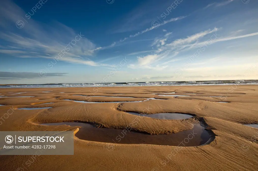 England, Northumberland, Embleton Bay. Patterns in the sand revealed by low-tide at Embleton Bay.