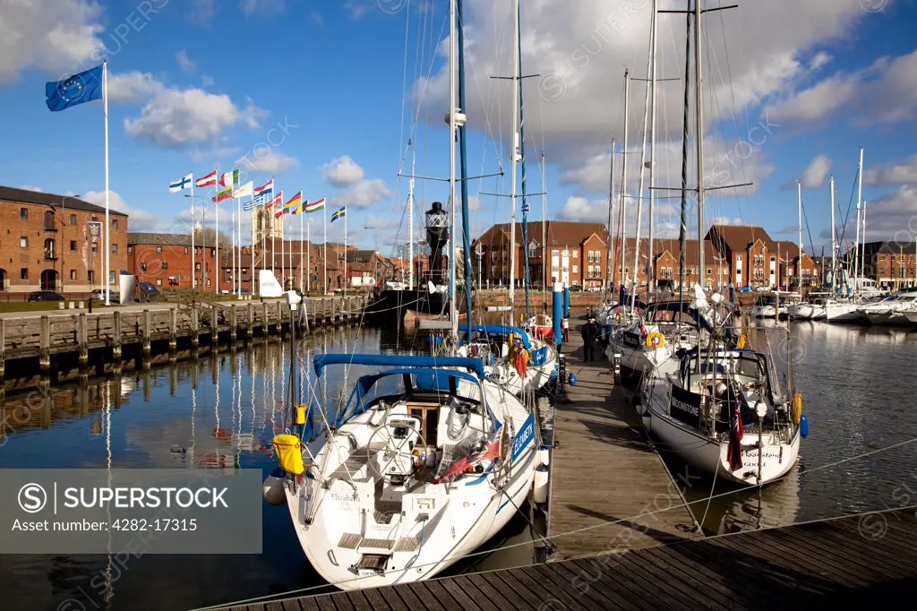 England, East Riding of Yorkshire, Kingston upon Hull. Boats moored either side of a jetty in Hull Marina.