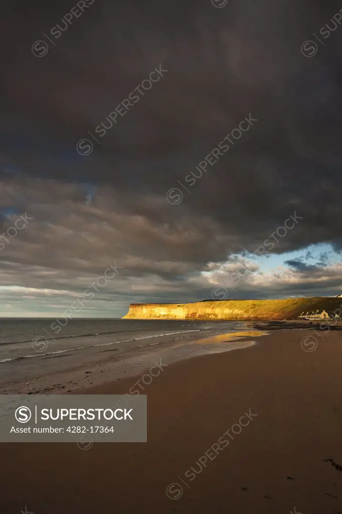 England, Redcar & Cleveland, Saltburn-By-The-Sea. Shaft of Sunlight on Huntcliff, a large vertical cliff a mile east of Saltburn.