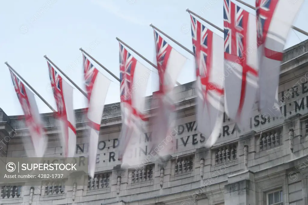 England, London, Admiralty Arch. Flags in the breeze at Admiralty Arch near to Buckingham Palace.