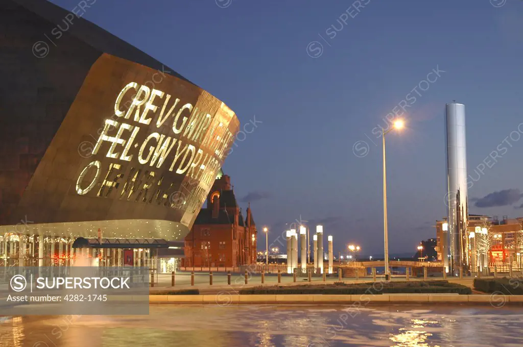 Wales, Cardiff, Millennium Centre. The Millennium Centre lit up at dusk.