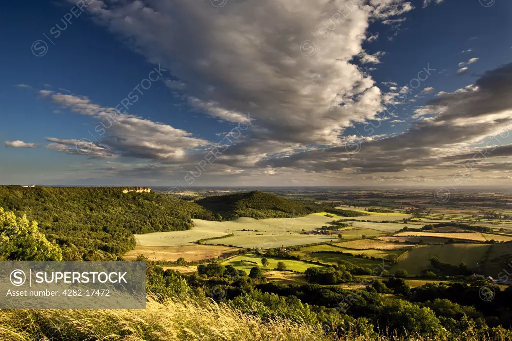 England, North Yorkshire, Sutton Bank. Roulston Scar and Hood Hill near Sutton Bank with Vale of York in the distance.