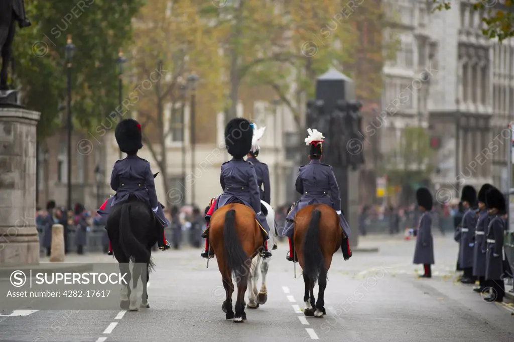 England, London, Westminster. Coldstream and Irish Guards on horseback in Whitehall during the State Opening of Parliament in central London.