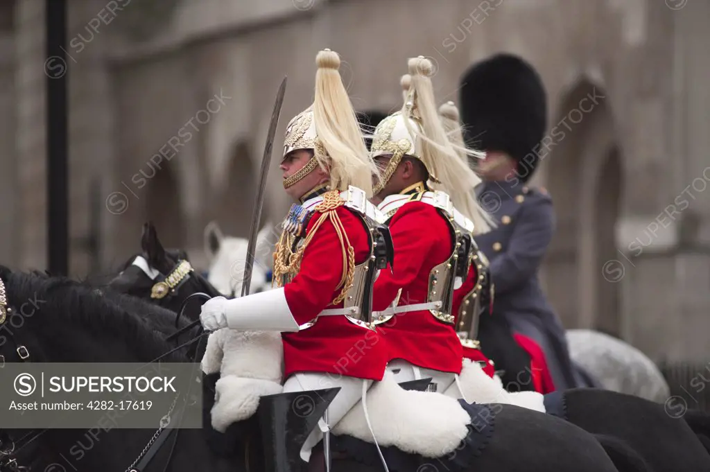 England, London, Westminster. Life Guards on horseback enter Whitehall from Horseguards Parade during the State Opening of Parliament in central London.