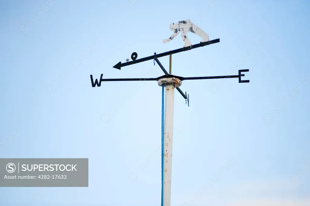 England, London, Merton. A weather vane above a bowling green in South London.