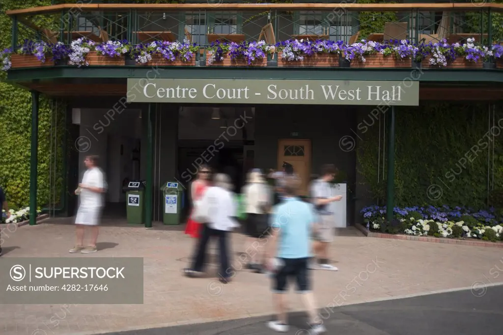 England, London, Wimbledon. Spectators outside the entrance to centre court at the Wimbledon lawn tennis championships in London.