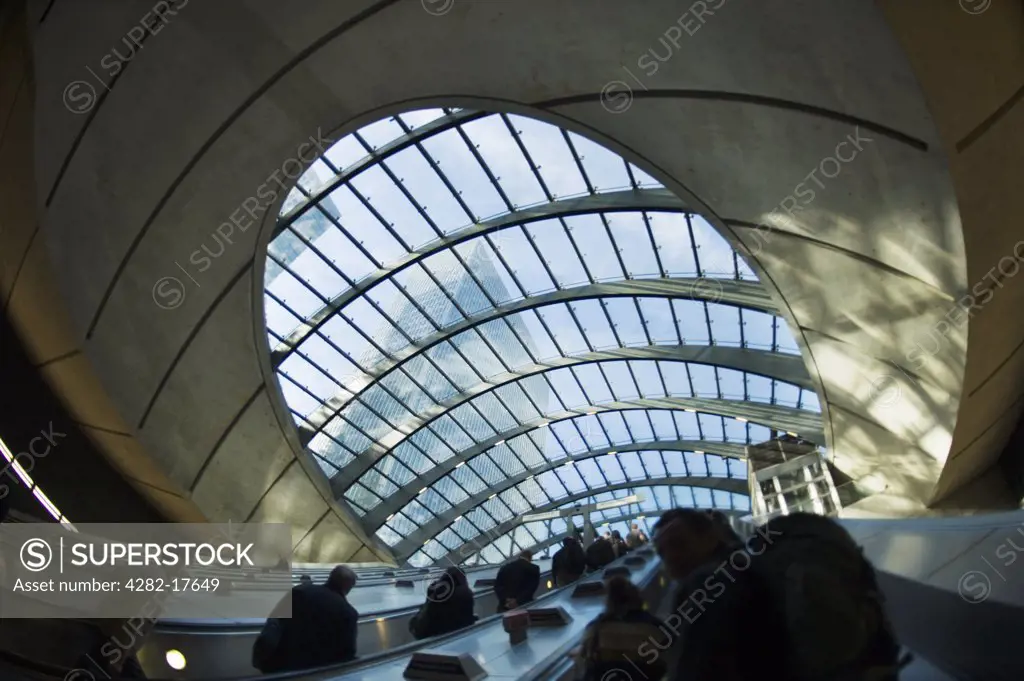 England, London, Canary Wharf. Passengers travelling up escalators in Canary Wharf underground station on the Jubilee line in London's Docklands.