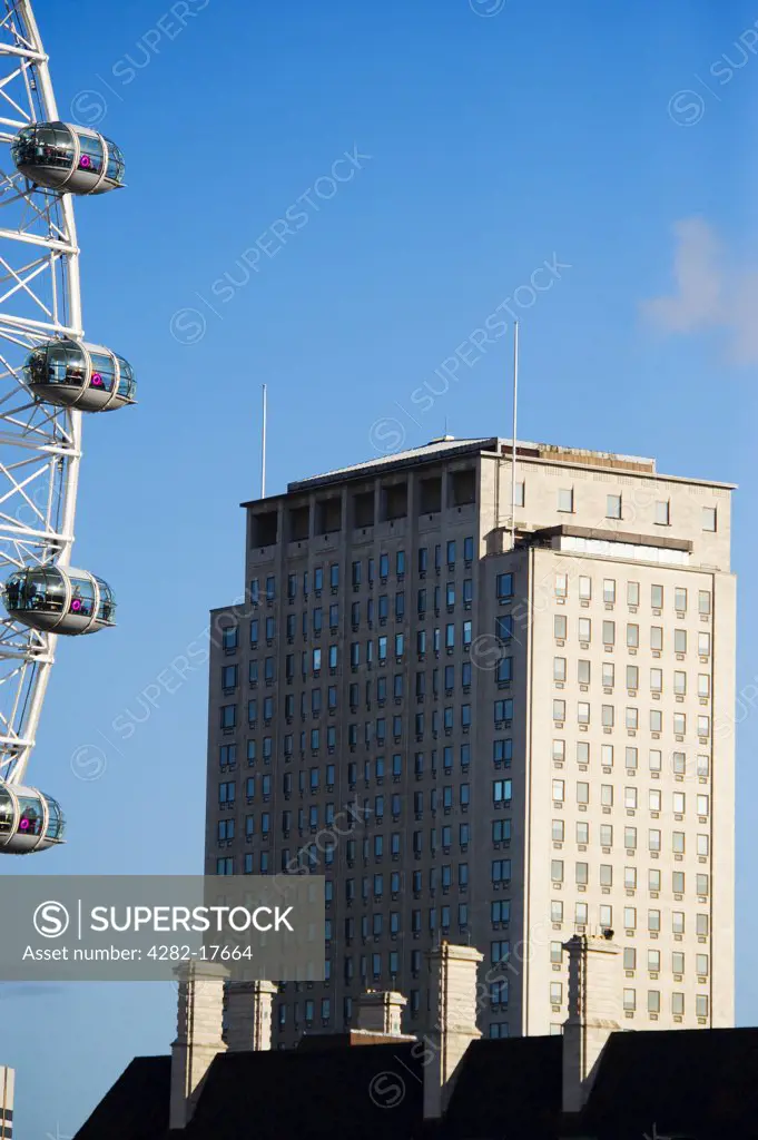 England, London, South Bank. The Shell Centre office building in Lambeth on the South Bank with pods of the landmark London Eye in the foreground.