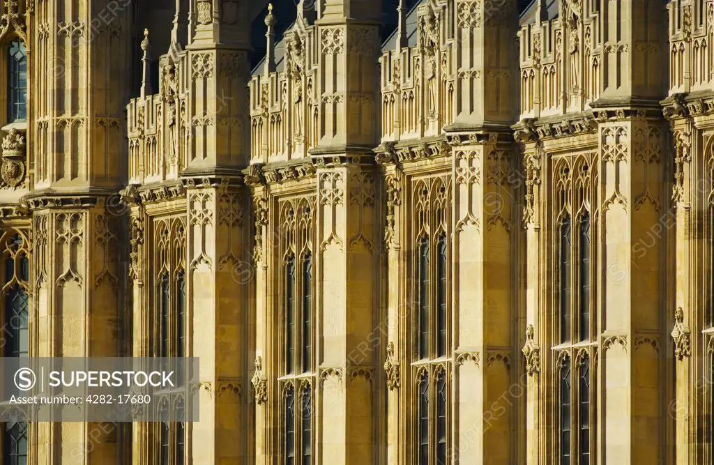 England, London, Westminster. Close-up of Gothic revival architecture of the houses of parliament, a landmark building in central London and home to the House of Lords and the House of Commons.