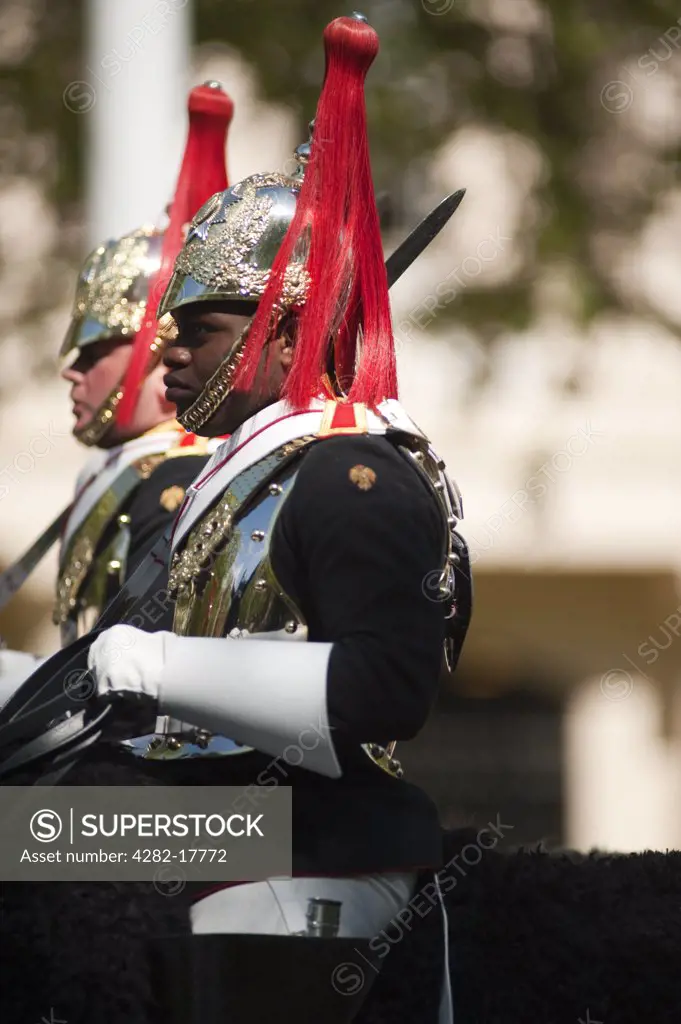 England, London, The Mall. Mounted Blues and Royals guards on the Mall in central London during the Changing of the Guard.