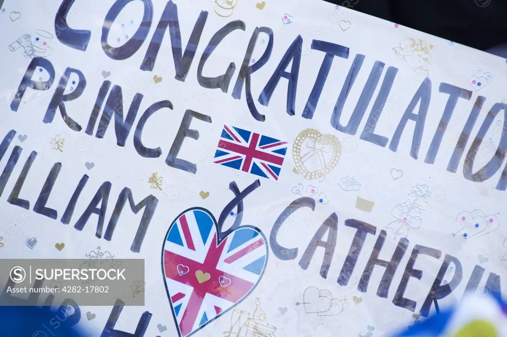 England, London, Westminster. A homemade poster offering congratulations to Prince William and Catherine Middleton outside Westminster Abbey, two days before the Royal Wedding.