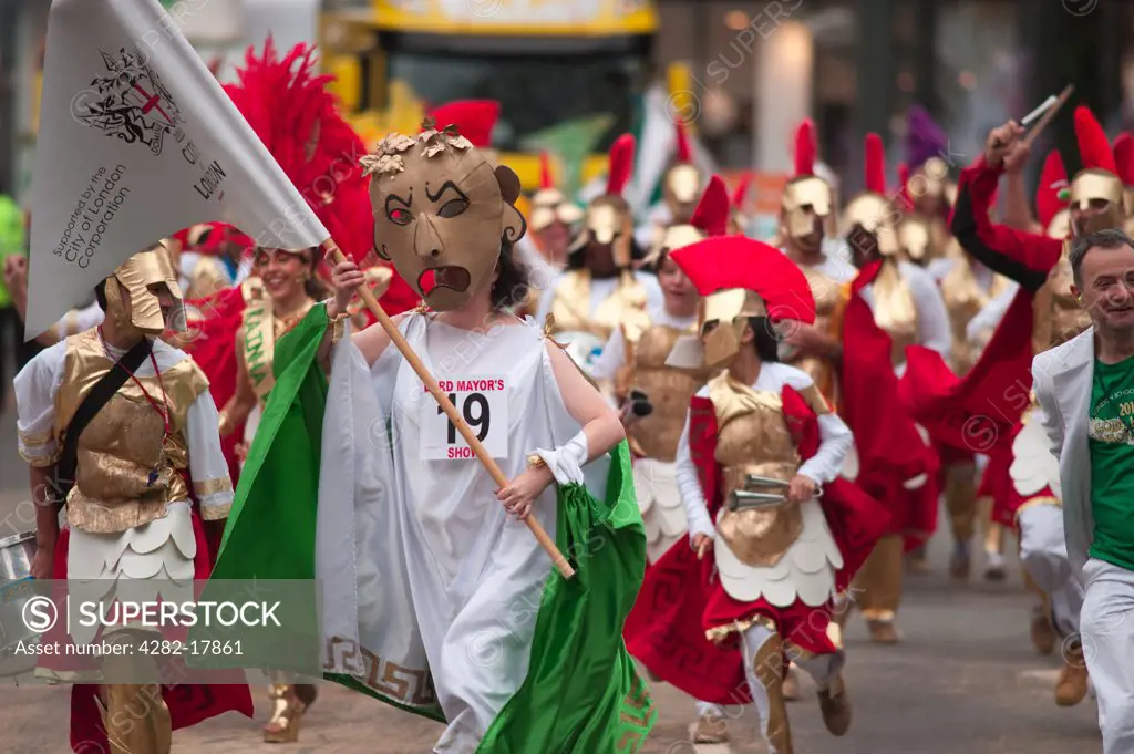 England, London, City of London. Members of the London School of Samba wearing costumes based on a theme of Gods, Myths and Monsters, in the procession at the annual Lord Mayor's Show in the City of London.