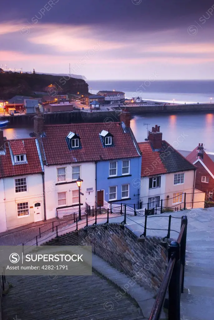 England, North Yorkshire, Whitby. An evening view over the old town of Whitby towards the North Yorkshire coast.