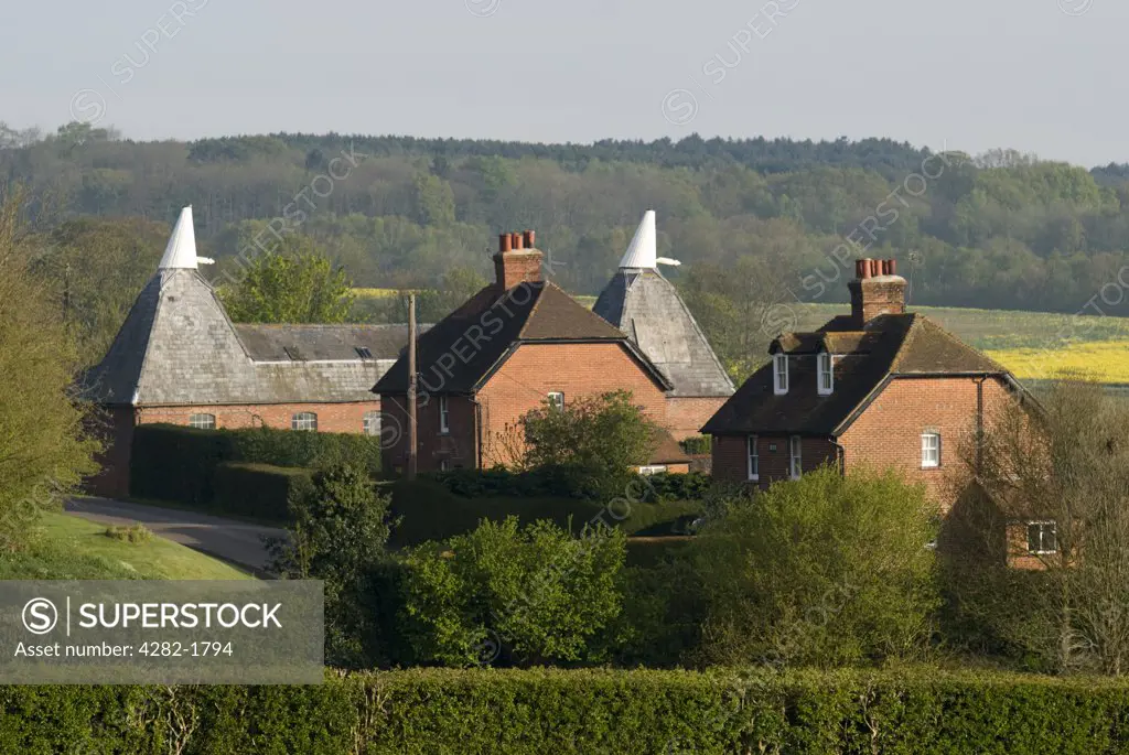 England, Kent, Reculver. A view to traditional oast houses and farm houses near Chatham in Kent.