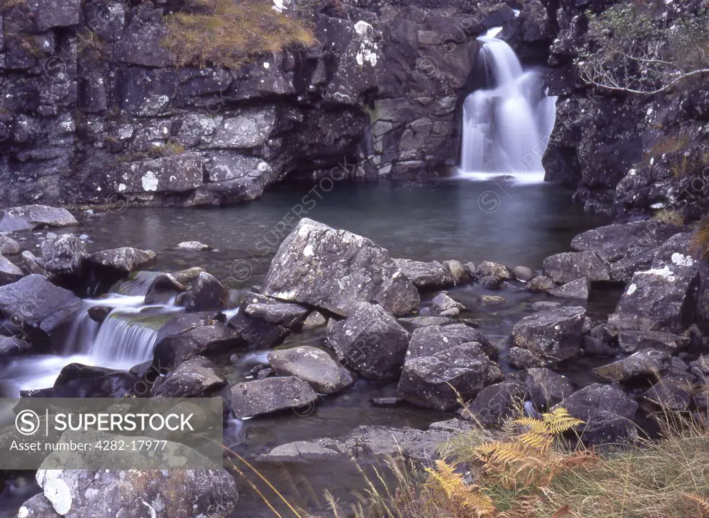 Scotland, Isle of Skye, Minginish. View of rock basin with small waterfalls.