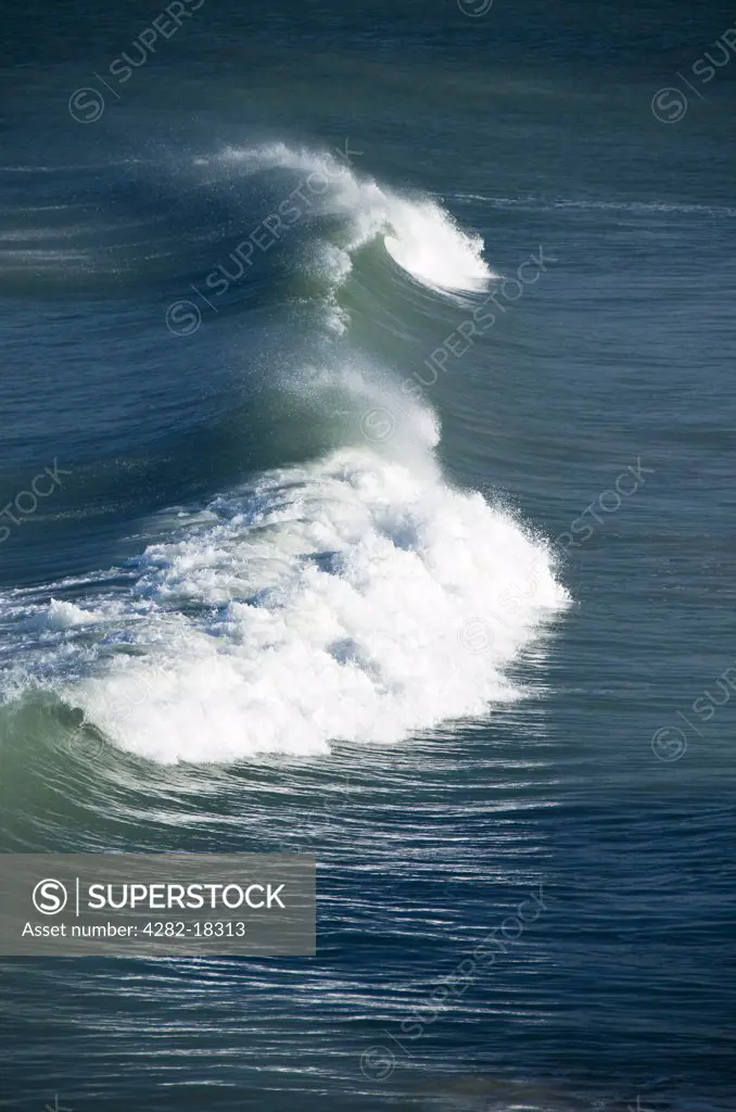 England, Cornwall, near St. Ives. A large wave in the sea near St Ives.
