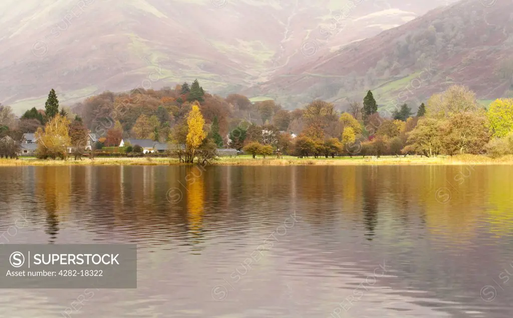 England, Cumbria, Grasmere. Autumnal colours reflected in Grasmere lake in the Lake District.