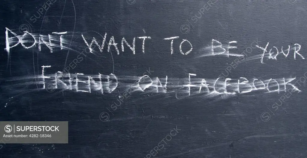 England, Kent, Whitstable. 'DONT WANT TO BE YOUR FRIEND ON FACEBOOK' written on a chalkboard.