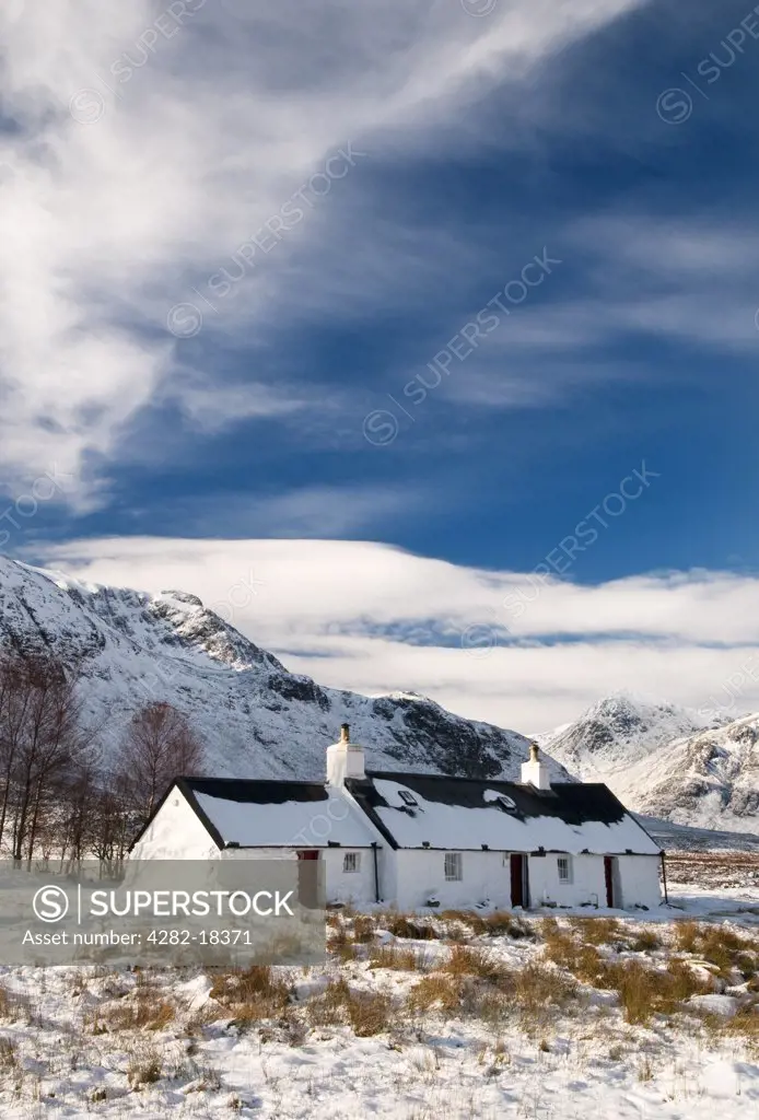 Scotland, Highland, Glencoe. A snow covered landscape featuring Black Rock cottage in Glencoe.